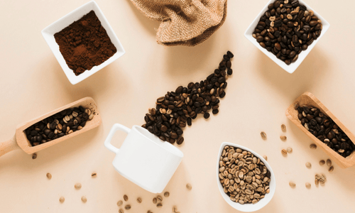 coffee mug with ground coffee coffee-beans.
