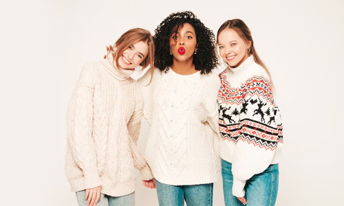 three women in cardigans